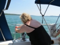 Debbie-trimming-the-head-sail